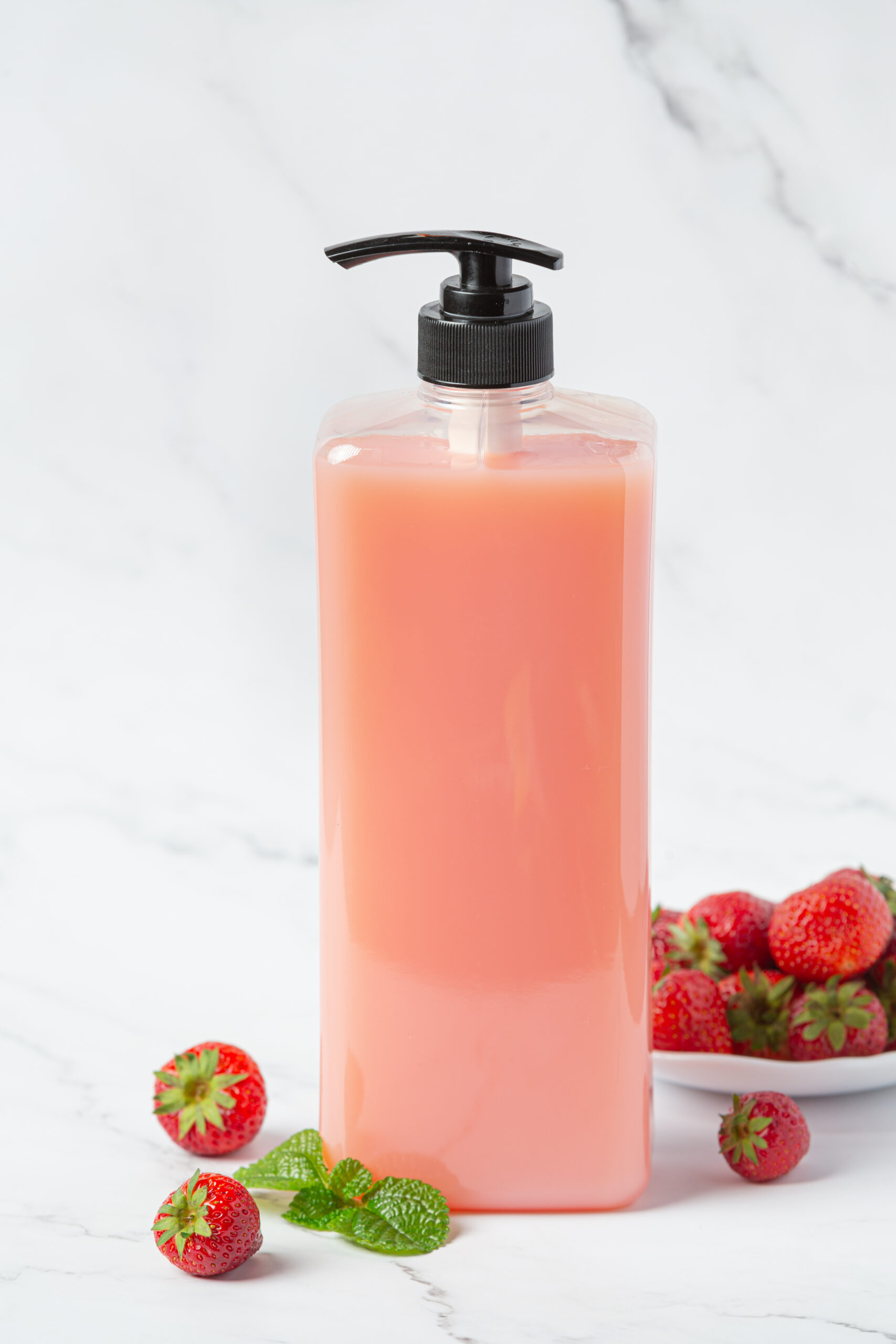 cosmetic bottle strawberry shampoo on white backgroud